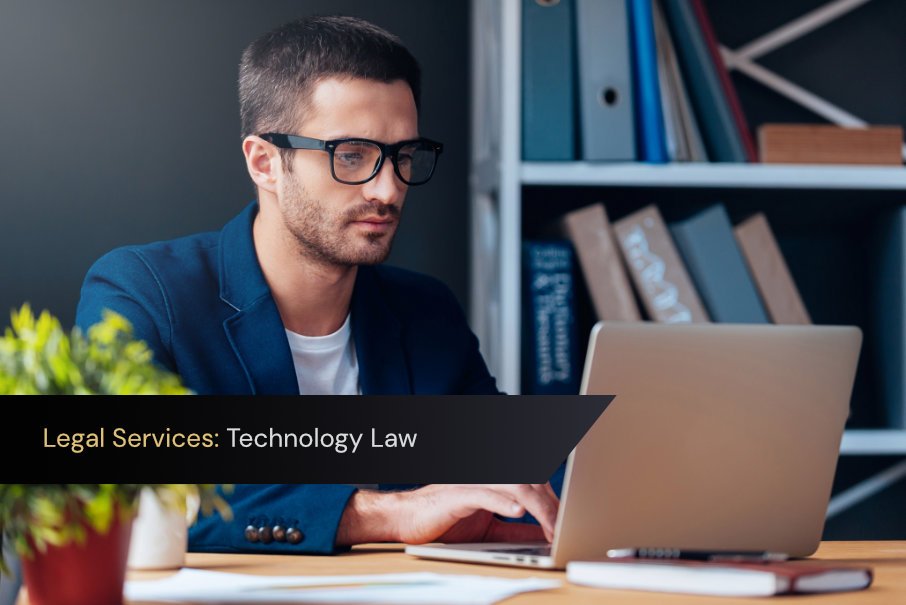 Technology lawyer working on a software contract on laptop.